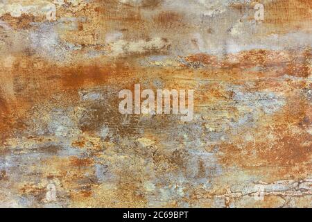 Unusual vintage texture of brown steel sheet of old metal with rust coated and gray patina spots. Stock Photo