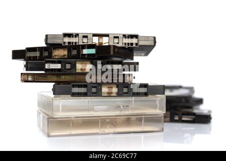 Pile of old audio cassette tapes isolated on white background, vintage music and technology concept Stock Photo