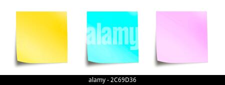 Three pastel colored sticky notes isolated on panoramic white background Stock Photo