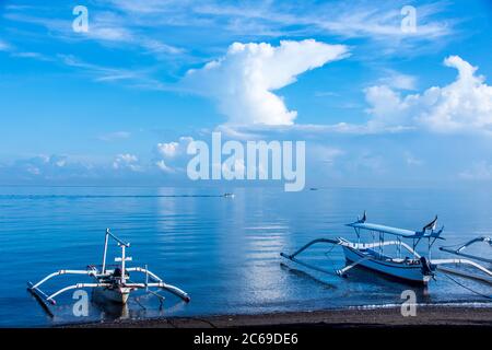 Traditional Balinese jukungs anchored on beach, Lovina, Bali, Indonesia Stock Photo