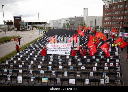 Hamburg, Germany. 08th July, 2020. Employees of the aircraft manufacturer Airbus are gathering outside the factory gates in Hamburg-Finkenwerder for a nationwide day of action against job cuts by the aircraft manufacturer. With the 2000 chairs in front of the main entrance, IG Metall wants to signal how many jobs are to be cut at the site. Credit: Christian Charisius/dpa/Alamy Live News Stock Photo