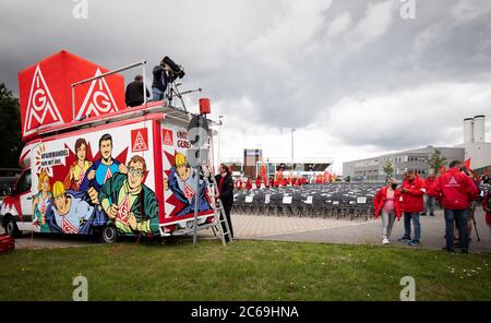 Hamburg, Germany. 08th July, 2020. Employees of the aircraft manufacturer Airbus are gathering outside the factory gates in Hamburg-Finkenwerder for a nationwide day of action against job cuts by the aircraft manufacturer. With the 2000 chairs in front of the main entrance, IG Metall wants to signal how many jobs are to be cut at the site. Credit: Christian Charisius/dpa/Alamy Live News Stock Photo