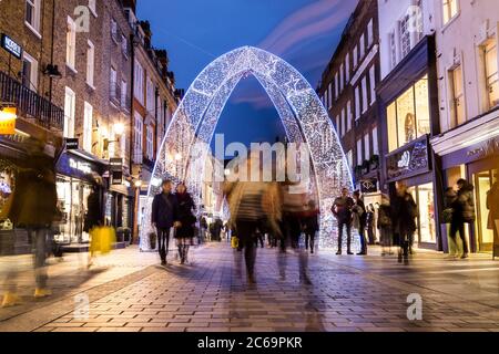 LONDON, UK - 30TH DECEMBER 2015: A view along South Molton Street in London during the Christmas Period showing the outside of buildings & decorations Stock Photo