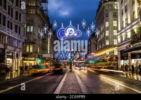 LONDON, UK - 27TH NOVEMBER 2015: A view along The Strand in London at night during the Christmas Season showing the streets and decorations. Traffic a Stock Photo