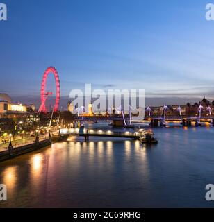 LONDON, UK - 10TH MARCH 2015: The Westminster Skyline from the East showing the London Eye, Hungerford Bridge, Westminster and other buildings Stock Photo