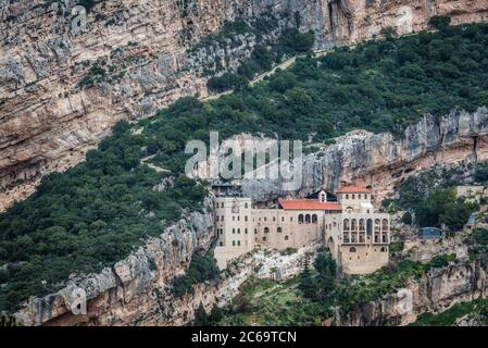 Our Lady of Hamatoura located in village of Kousba, in the rocky hollow of a high cliff overlooks the holy valley of Kadisha, Lebanon Stock Photo
