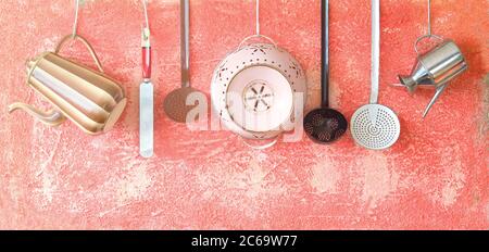 Various vintage kitchen utensils on a rustic wall, good copy space Stock Photo