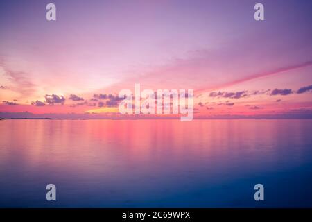Sunset sunrise seascape. Inspirational calm sea with sunset sky. Meditation ocean and sky background. Colorful horizon over the water Stock Photo