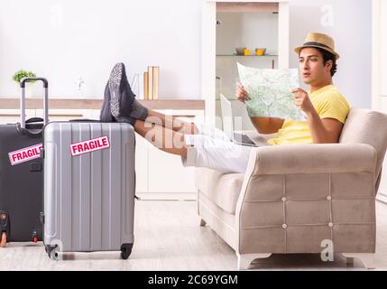 The man going on vacation with fragile suitcases Stock Photo