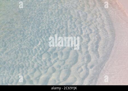 Clear water surface with white sand. Stock Photo
