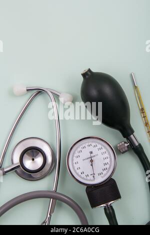 Top view of pills and capsules outside the package next to equipment and medical devices. Stock Photo