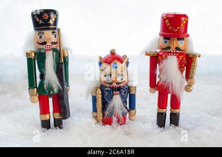 Three Nutcrackers in a Christmas Snow Scene Stock Photo