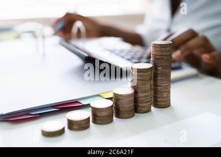 African American Tax Payment And Inflation Calculator Stock Photo