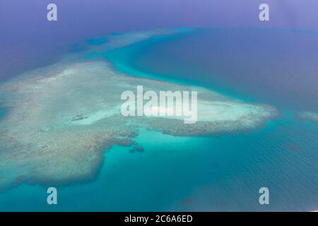 Great Barrier Reef Blue Sea view. Beautiful aqua turquoise waters, with coral reef patterns in the ocean. Aerial view, seascape Stock Photo