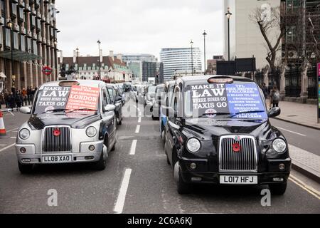 Taxis block roads in Westminster in protest  Stock Photo