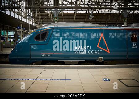FirstGroup Trenitalia Avanti West Coast rail franchise WCML West Coast Main line Alstom Class 390 Pendolino train from London To Manchester at Mcr Pic Stock Photo