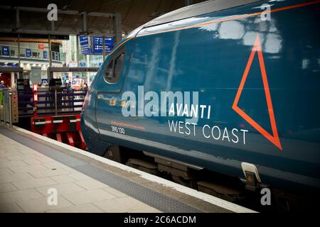 FirstGroup Trenitalia Avanti West Coast rail franchise WCML West Coast Main line Alstom Class 390 Pendolino train from London To Manchester at Mcr Pic Stock Photo