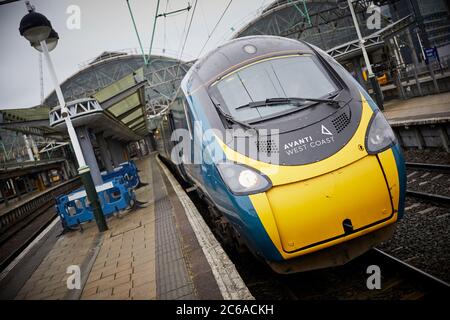FirstGroup Trenitalia Avanti West Coast rail franchise WCML West Coast Main line Alstom Class 390 Pendolino train from London To Manchester at Mcr Pic Stock Photo