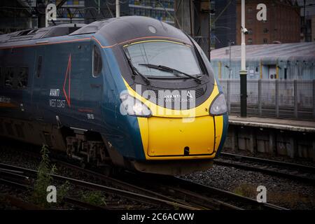 FirstGroup Trenitalia Avanti West Coast rail franchise WCML West Coast Main line Alstom Class 390 Pendolino train from London To Manchester at Mcr Pic Stock Photo