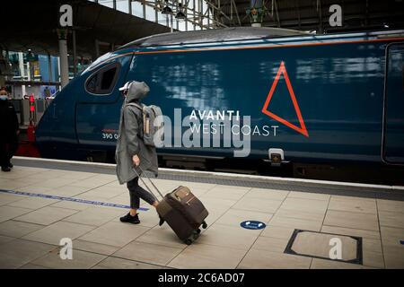 FirstGroup Trenitalia Avanti West Coast rail franchise WCML West Coast Main line Alstom Class 390 Pendolino train from London To Manchester at Mcr Pic Stock Photo