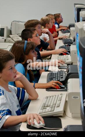 Gun Barrel City, Texas USA, September 9, 2003: Fourth and fifth graders at computer lab at Southside Elementary, working on math and reading software programs during scheduled computer time.   ©Bob Daemmrich Stock Photo