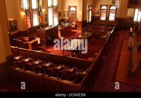 Victoria, Texas August 11, 2003: Sunlight filters through the large windows in the courtroom of the old Victoria County Courthouse, used from 1893 to 1967. Designed by noted courthouse architect J. Riely Gordon, it is considered one of the most beautiful in the Lone Star State.  ©Bob Daemmrich Stock Photo