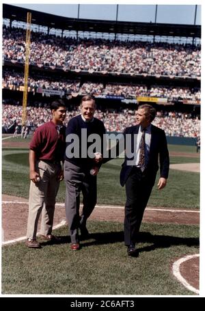 P30541-17   Right to left: George W. Bush with his father, President George H. Bush, and his nephew, George P. Bush, throwing out the opening pitch in Oriole Park at Camden Yards in Baltimore, MD., 06 Apr 92, before the Orioles' opening game of the season. Photo Credit:  George Bush Presidential Library Stock Photo