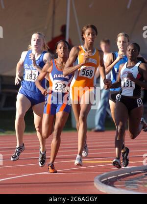 Austin, Texas USA, June 2004: Women run the curve while competing in the 800-meter run at the National Collegiate Athletic Association (NCAA)) Division I Outdoor Track & Field Championships.  ©Bob Daemmrich Stock Photo