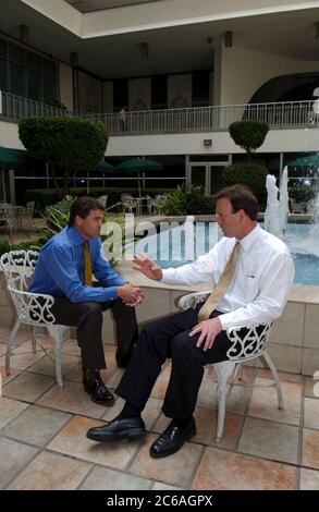 Mexico City DF, Mexico, June 2004: During a trade mission to Mexico City, Texas Governor Rick Perry (left) talks with U.S. Ambassador to Mexico, Tony Garza at the U.S. Embassy. ©Bob Daemmrich Stock Photo