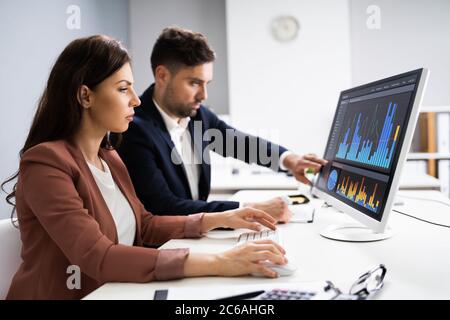 Financial Advisor And Business Analyst Working On Computer Stock Photo