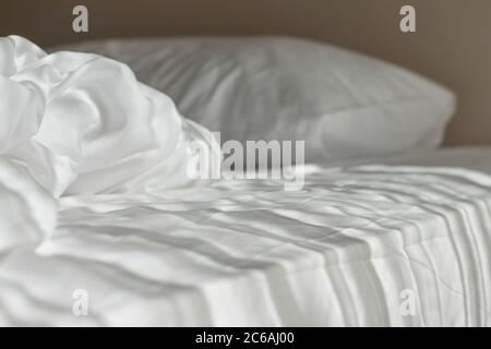 White mattress in the morning with the light lay on the bed. Stock Photo