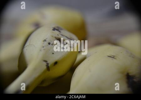 Banana, bunch of yellow bananas, with emphasis on the fruit handle, in photo zoom, with intentional blur, Brazil, South America Stock Photo