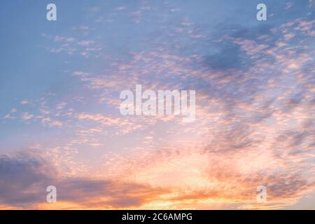 Dramatic cloudy golden colored sunset sky. Natural background Stock Photo