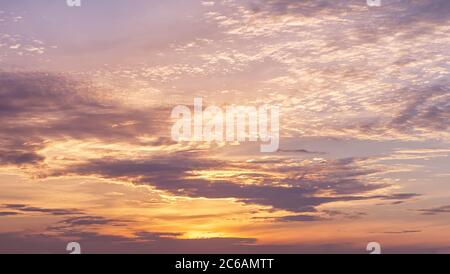 Dramatic cloudy pastel colored sunset sky. Natural background Stock Photo