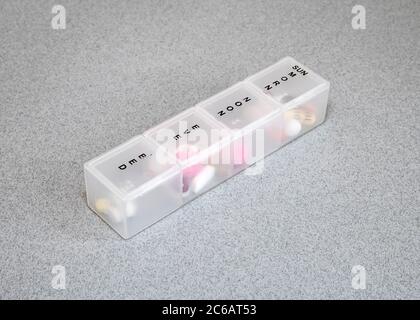 Daily pill box for medication Stock Photo