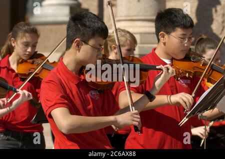 Austin, Texas USA, February 28 2005: Members of the Chisolm Trail Middle School Honor Orchestra of Round Rock, TX perform at the Texas Capitol in support of more arts education funding for Texas public schools.  ©Bob Daemmrich Stock Photo