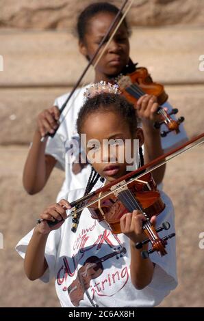 Austin, Texas USA, February 28 2005: Members of the Caldwell Elementary Suzuki Strings group perform at the Texas Capitol in support of more arts education funding for Texas public schools.  ©Bob Daemmrich Stock Photo