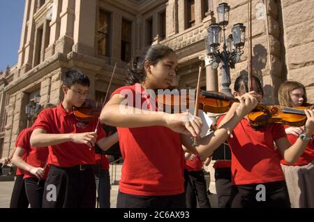 Austin, Texas USA, February 28 2005: Members of the Chisolm Trail Middle School Honor Orchestra of Round Rock, TX perform at the Texas Capitol in support of more arts education funding for Texas public schools.  ©Bob Daemmrich Stock Photo