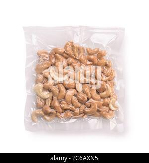 Vacuum plastic bag of cashew nuts isolated on white Stock Photo
