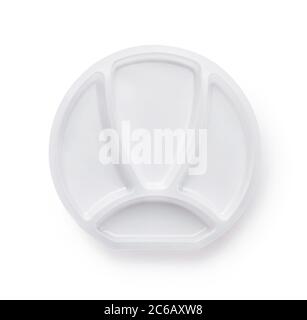 Top view of four compartment white plastic plate isolated on white Stock Photo