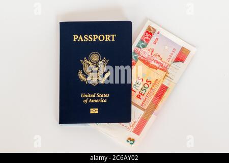 American passport and convertible cuban peso currency. Concept photo for American trade, commerce, business, and tourism with Cuba. Stock Photo