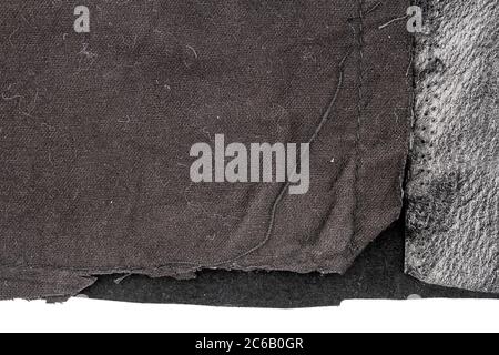 Piece of messy black leather isolated on white background. Crumpled material texture. Back side Stock Photo