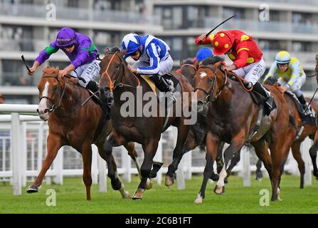 Cairn Gorm and jockey Tom Marquand (left) win the Oakley Coachbuilders EBF Novice Auction Stakes at Newbury Racecourse. Stock Photo