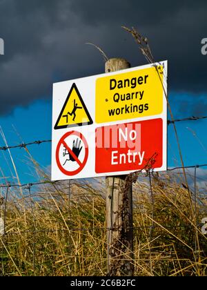 Danger Quarry Workings No Entry hazard warning sign outside a quarry ...