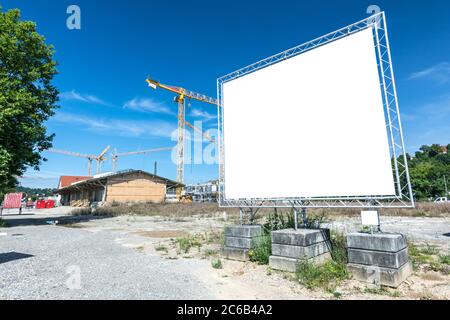 Large blank billboard on construction site Stock Photo