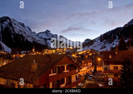 Night shot of cosy mountain village in the Italian Alps in winter Stock Photo