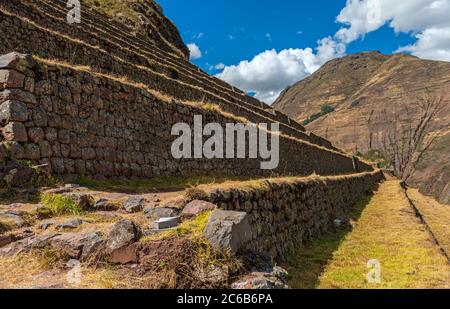 Inca walls and agriculture terraces in the ruin of Pisac, Sacred Valley, Cusco, Peru. Stock Photo