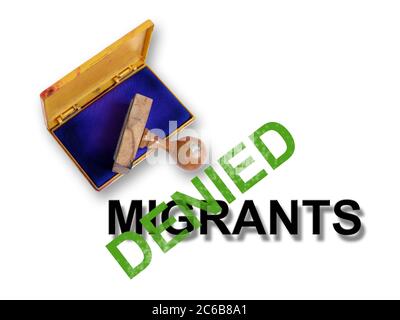 Top view of a rubber stamp with a giant word   - denied and word migrants isolated on white Stock Photo