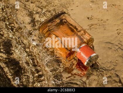 Perfume for man in a water splash Stock Photo