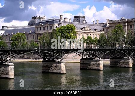 Famous pedestrian bridge crossing the Seine river Stock Photo